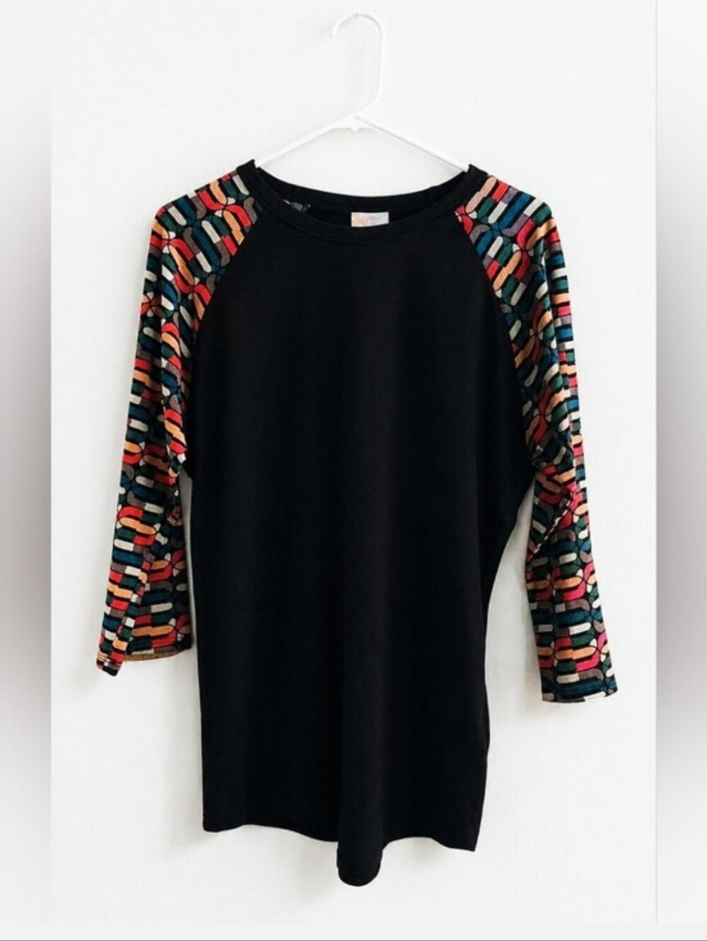 LuLaRoe Black Raglan Top with Multicolor Geometric Sleeves